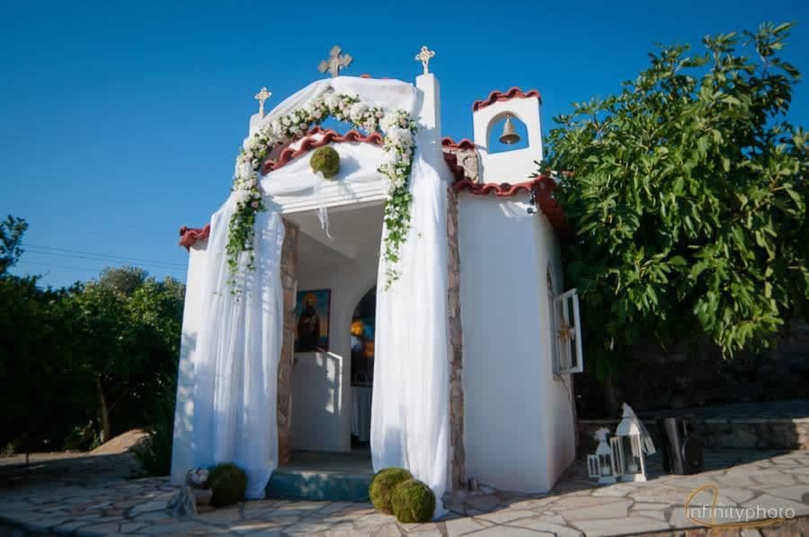 St. Stylianos wedding chapel with floral arch — reception venue Attica