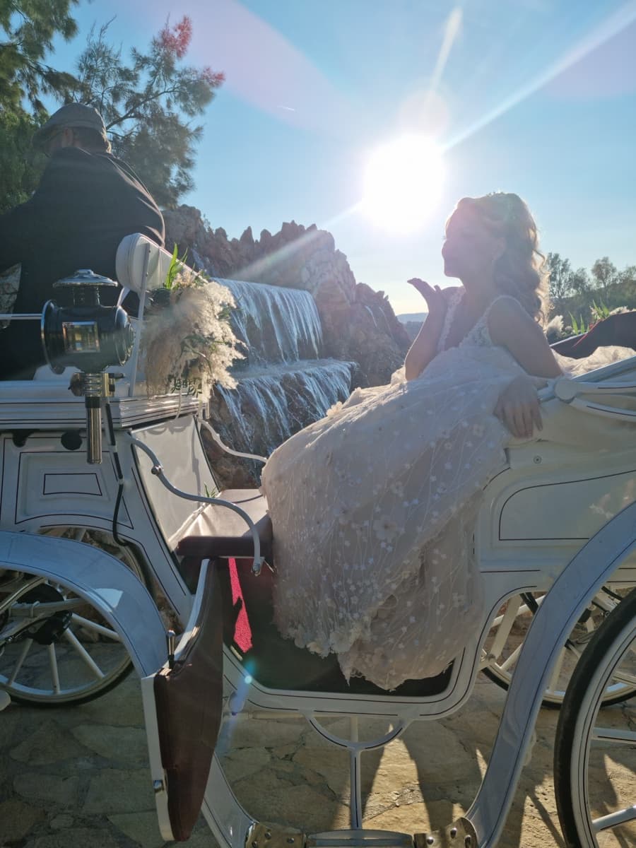 Bride arrival by white horse carriage at Ktima Filokalis wedding venue Koropi