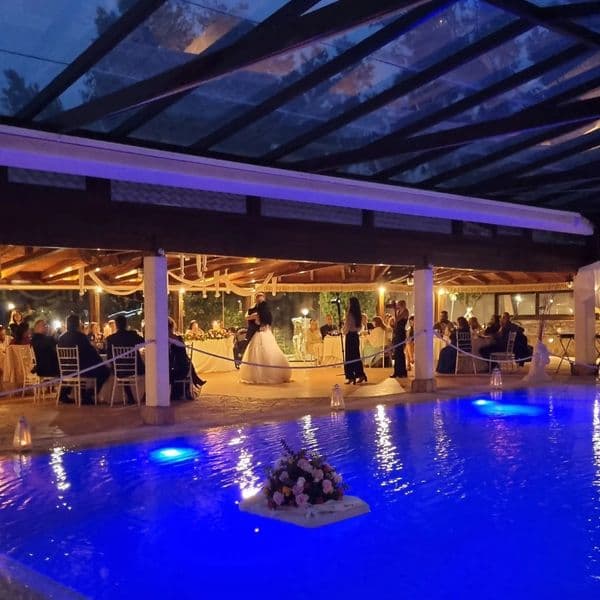 Illuminated pool at evening wedding reception — Ktima Filokalis Koropi